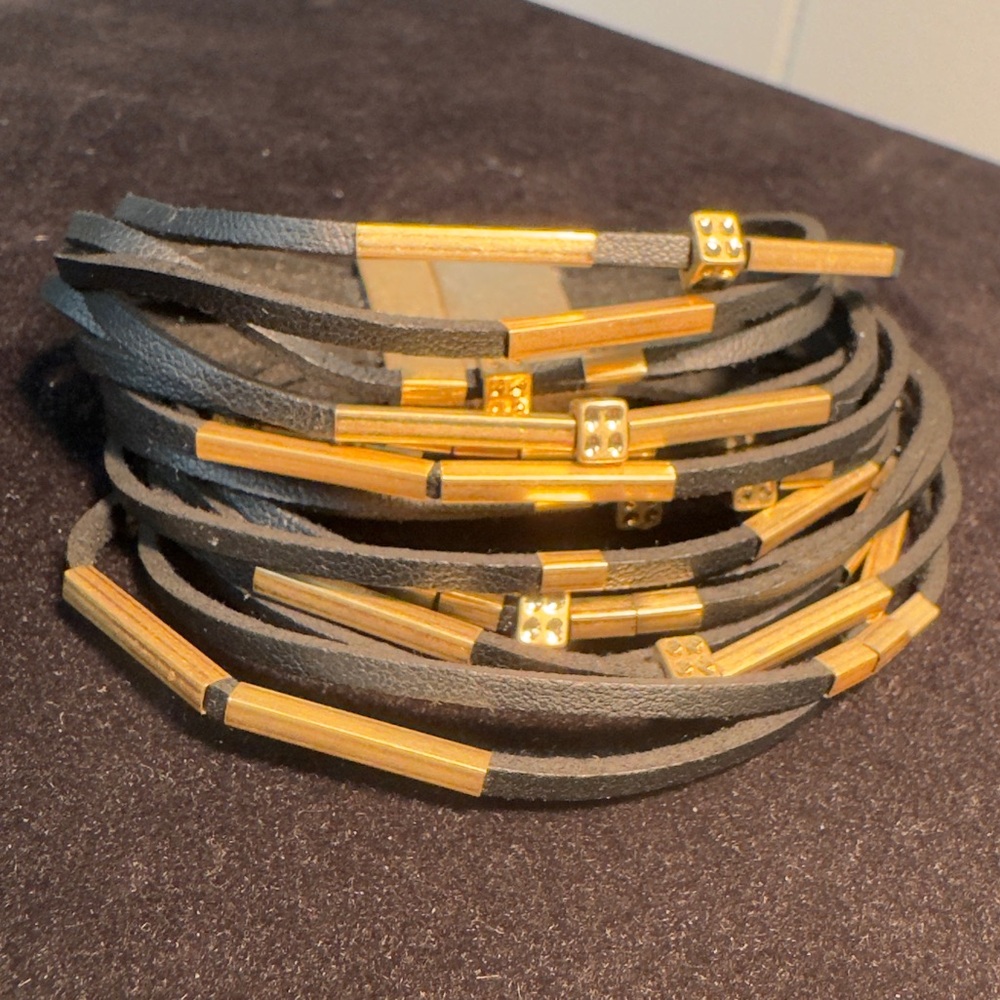 Magnetic Clasp Bracelet with leather strands and gold tone accents.